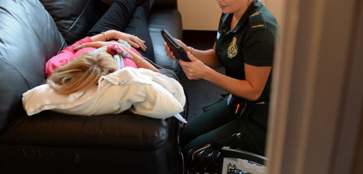 Paramedic Kate Whiting with a patient