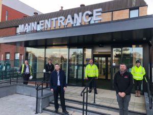 ESNEFT Associate director of Estate Development Mark Finch (pictured front left, with other members of the building project teams) at the new south entrance to Ipswich Hospital