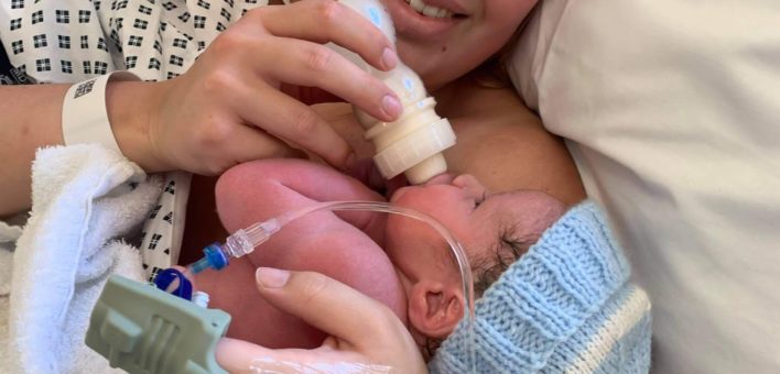 Mum feeding newborn baby in hospital